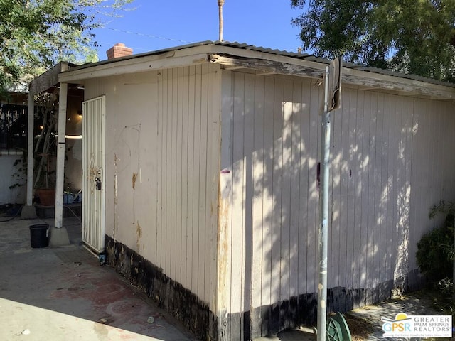 view of side of property with a patio