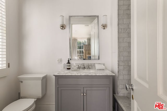 bathroom with vanity and toilet