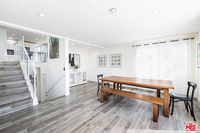 dining space featuring hardwood / wood-style flooring