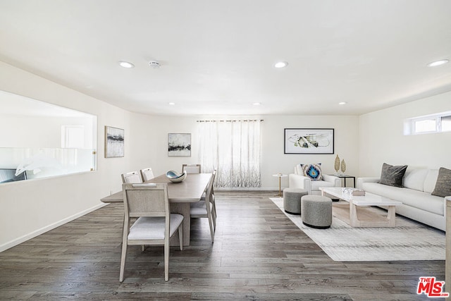 dining space featuring dark hardwood / wood-style flooring