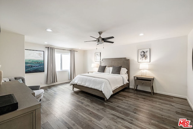 bedroom featuring ceiling fan and dark hardwood / wood-style flooring