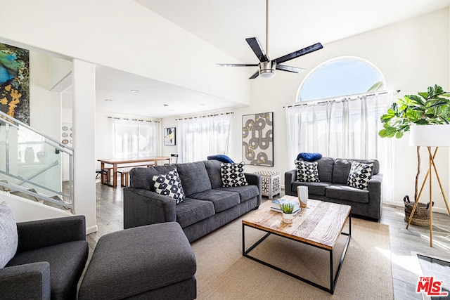 living room featuring light hardwood / wood-style floors and ceiling fan