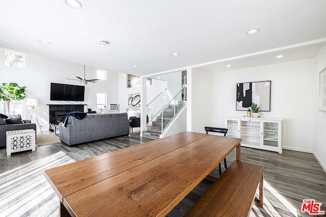 dining room with ceiling fan and wood-type flooring