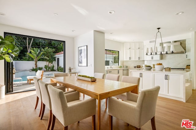 dining area with light hardwood / wood-style floors