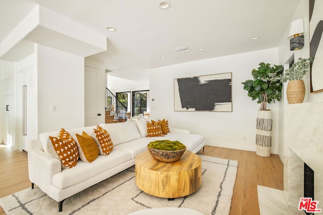 living room with light hardwood / wood-style floors