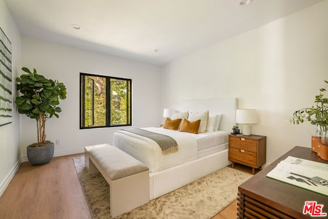 bedroom featuring light hardwood / wood-style floors