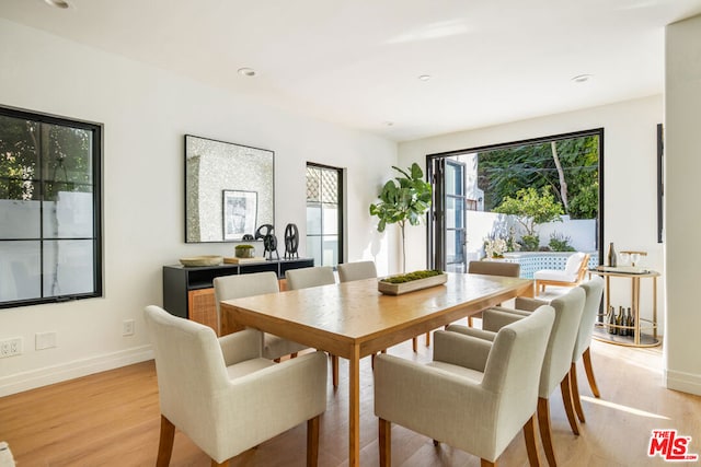 dining area featuring light wood-type flooring