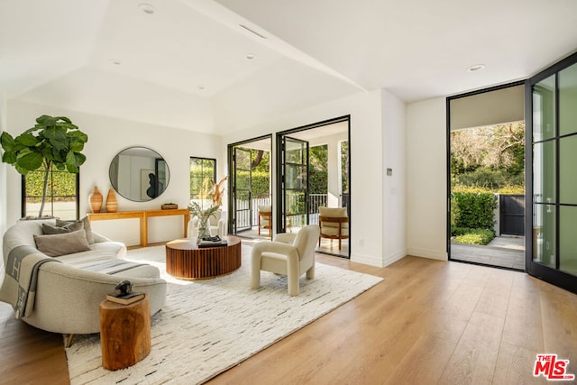 interior space with light hardwood / wood-style floors and floor to ceiling windows