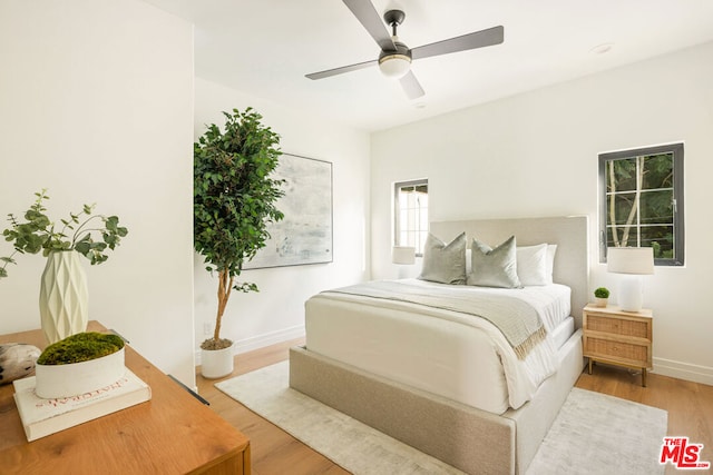 bedroom featuring hardwood / wood-style flooring and ceiling fan