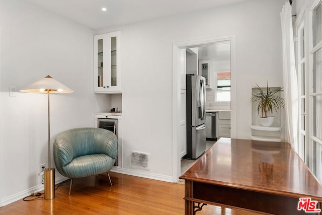 sitting room with light hardwood / wood-style flooring