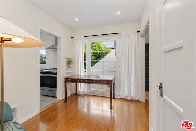 dining area featuring light hardwood / wood-style flooring and a wealth of natural light