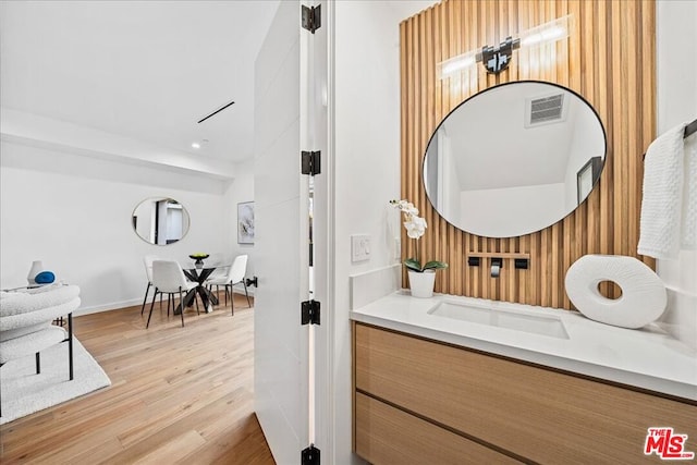 bathroom featuring vanity and hardwood / wood-style flooring