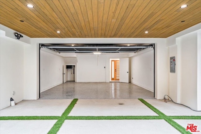 garage with electric panel and wood ceiling