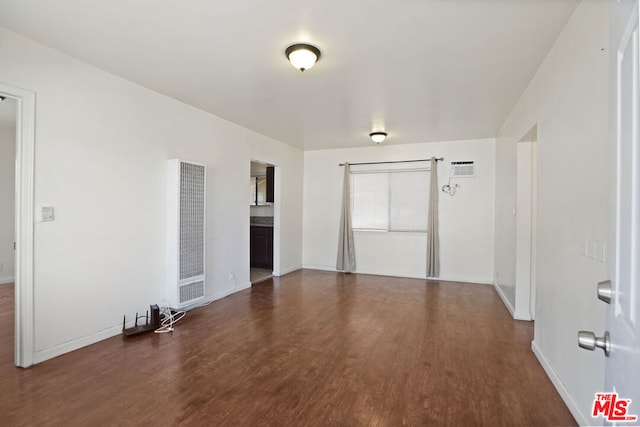 empty room featuring dark wood-type flooring