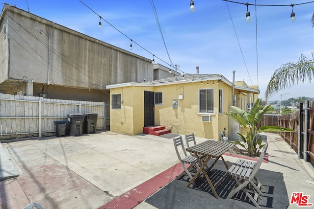 rear view of house with a patio