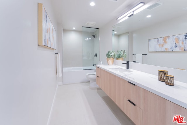 full bathroom featuring vanity, toilet, and tiled shower / bath