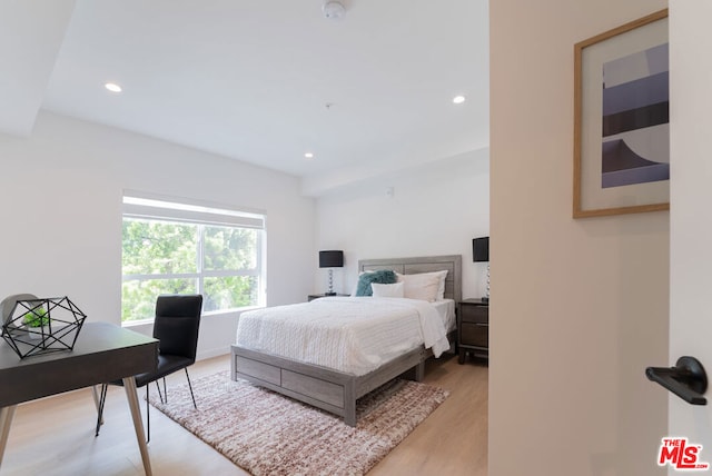 bedroom with light hardwood / wood-style floors