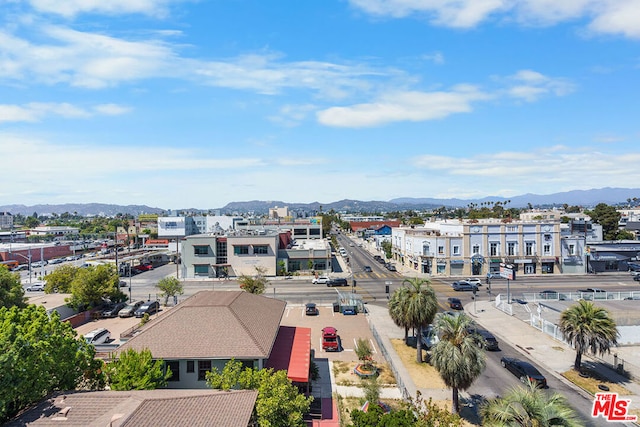 birds eye view of property with a mountain view