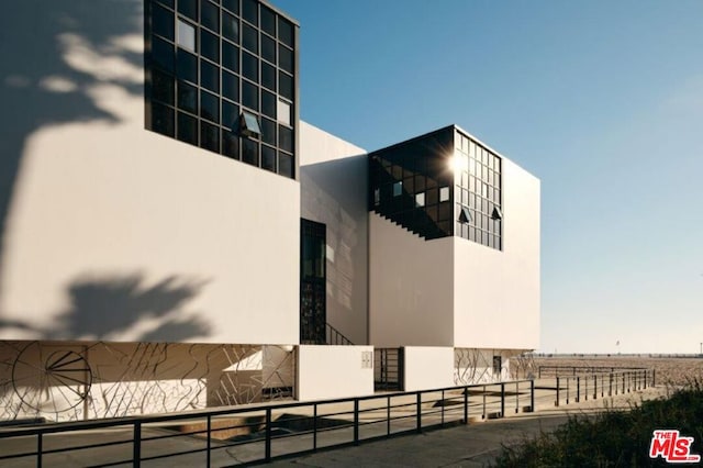 view of home's exterior with a rural view