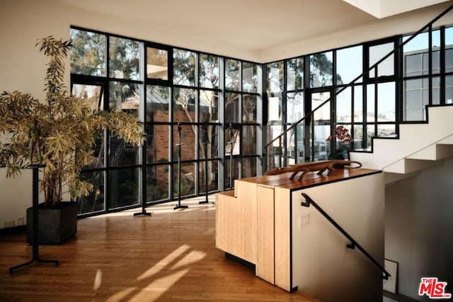 bar with light hardwood / wood-style flooring