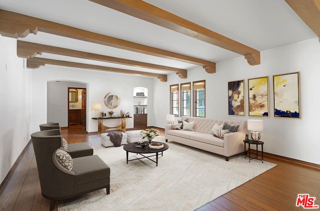 living room featuring beam ceiling and wood-type flooring