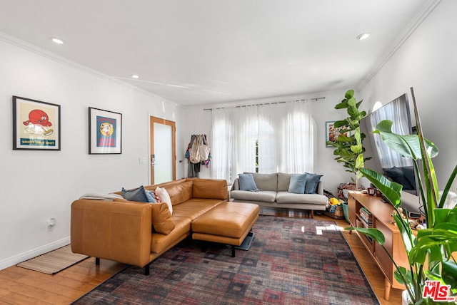 living room with dark hardwood / wood-style flooring and ornamental molding