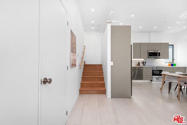 stairway with tile patterned flooring