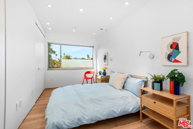 bedroom with light hardwood / wood-style flooring