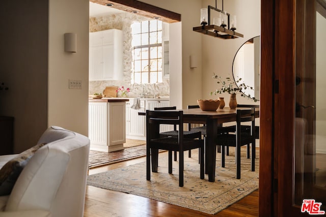 dining room with dark hardwood / wood-style flooring