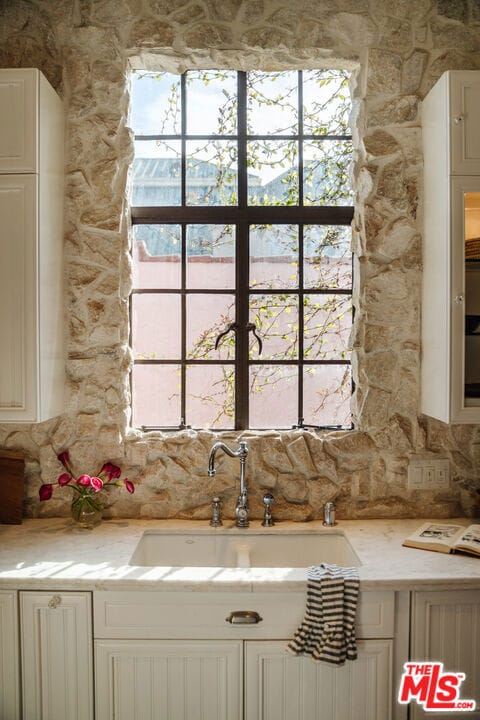 kitchen with white cabinets and sink