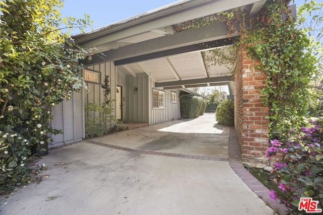 view of vehicle parking with a carport