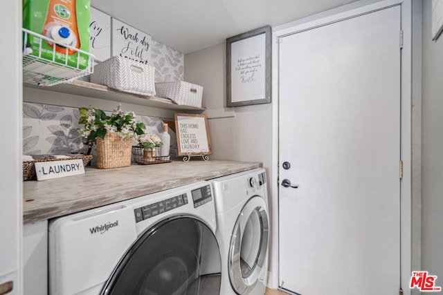 laundry area with washing machine and dryer