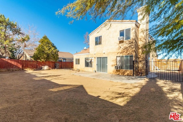 back of house featuring a patio area