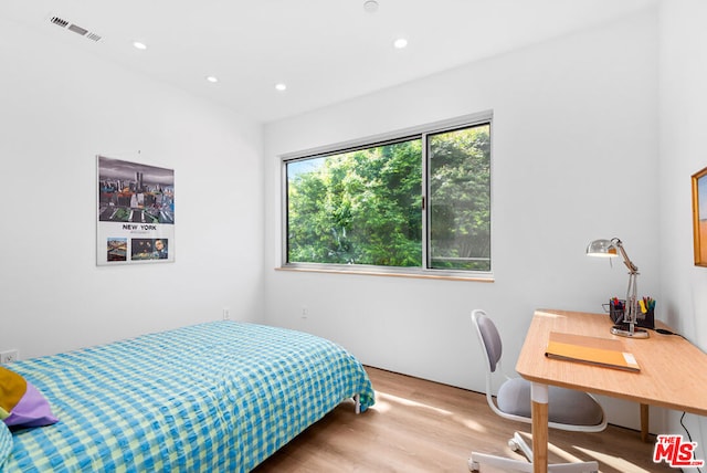 bedroom with light hardwood / wood-style flooring