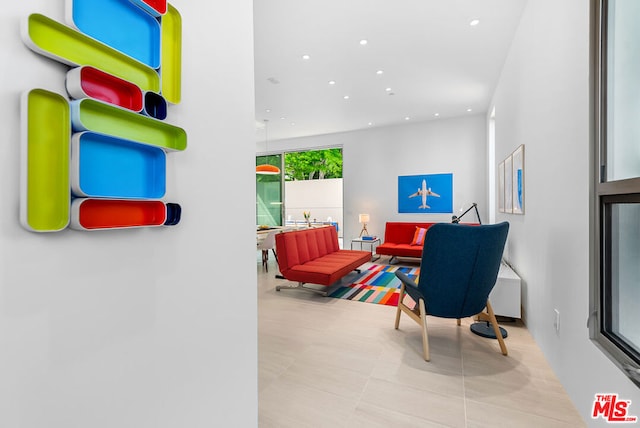 living room featuring floor to ceiling windows