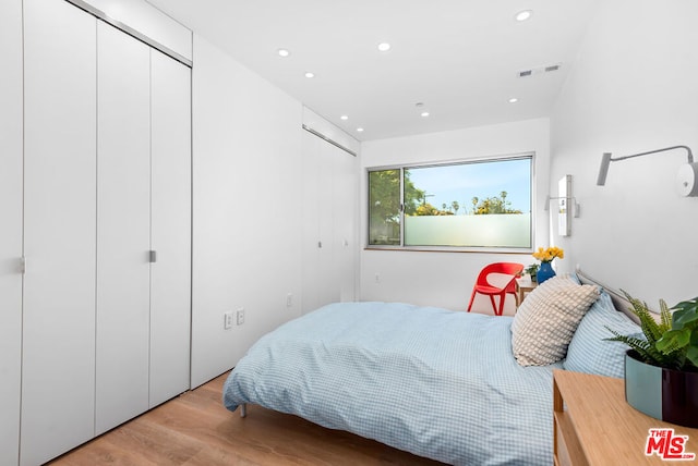 bedroom with light hardwood / wood-style floors