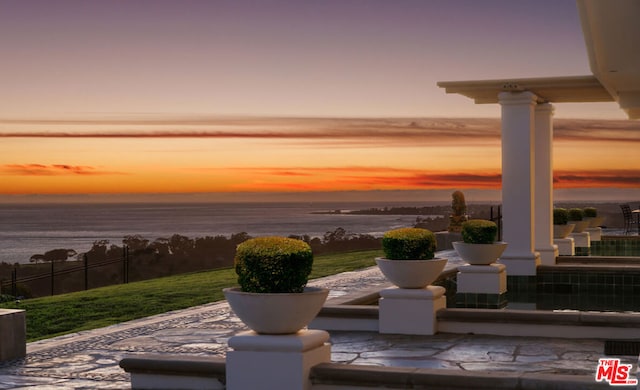 patio terrace at dusk with a water view