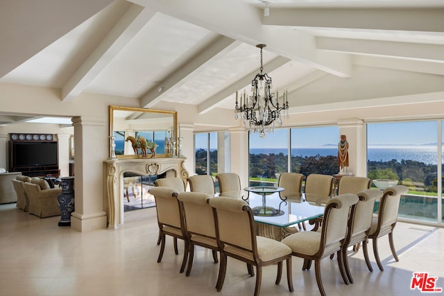 dining area featuring a mountain view, lofted ceiling with beams, and a chandelier