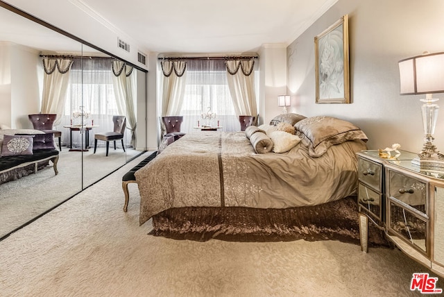 bedroom with carpet floors, ornamental molding, and multiple windows