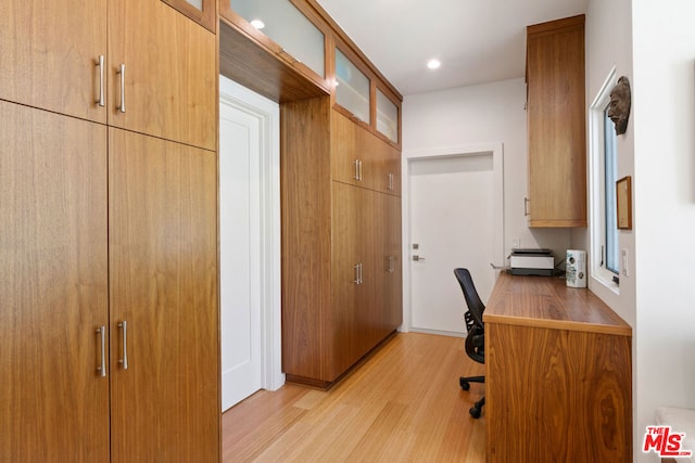 office with light hardwood / wood-style floors