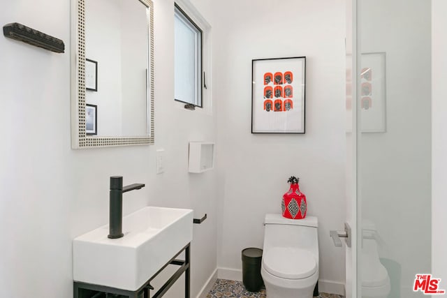 bathroom with toilet and sink