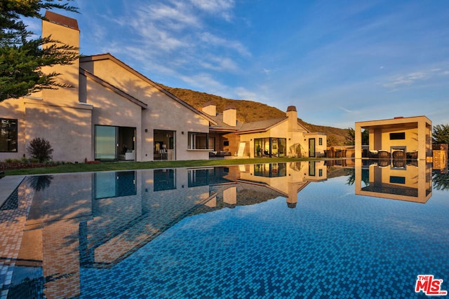 view of swimming pool featuring a mountain view