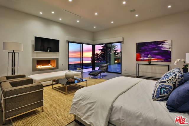 bedroom featuring access to outside and light carpet