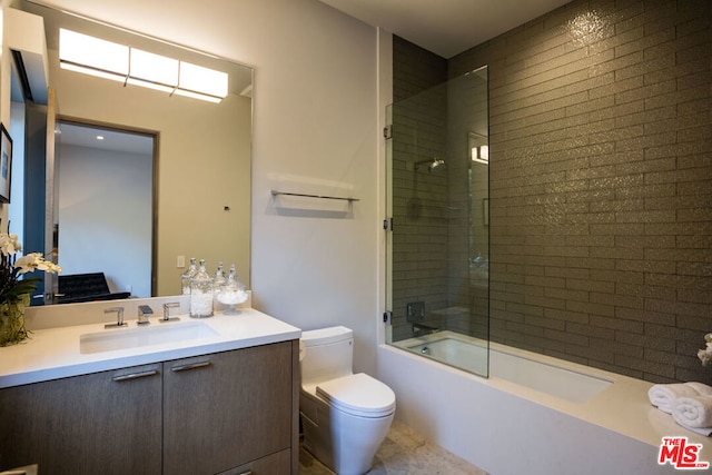 full bathroom with vanity, toilet, and bath / shower combo with glass door