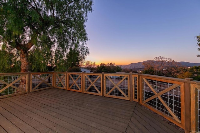 deck at dusk with a mountain view