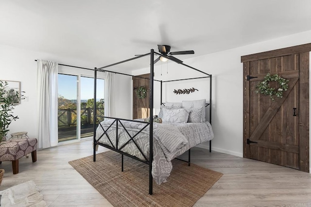 bedroom featuring access to outside, ceiling fan, and light hardwood / wood-style flooring