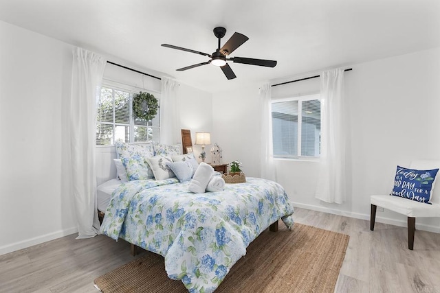 bedroom featuring light hardwood / wood-style flooring and ceiling fan