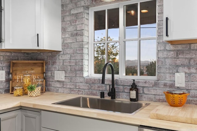 kitchen with white cabinets and sink