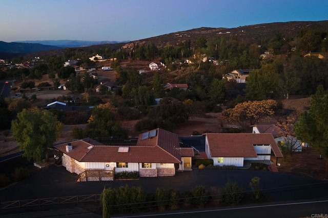 aerial view at dusk with a mountain view