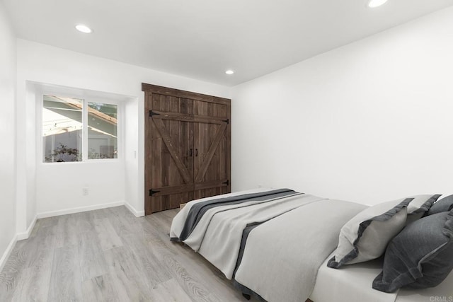 bedroom with light wood-type flooring